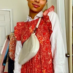 Long, orange and red floral dress.
